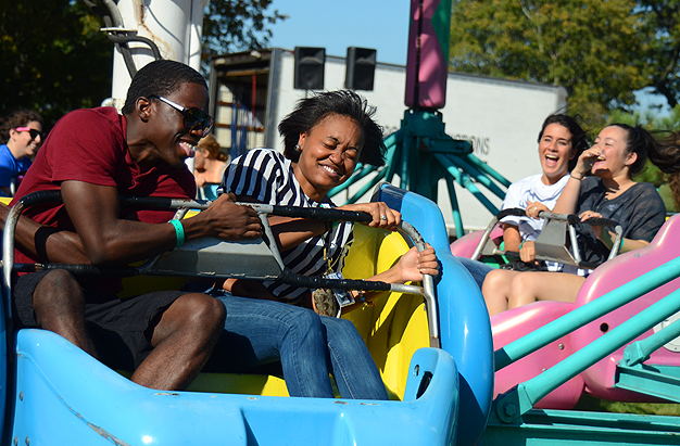 Friends laughing on a roller coaster ride